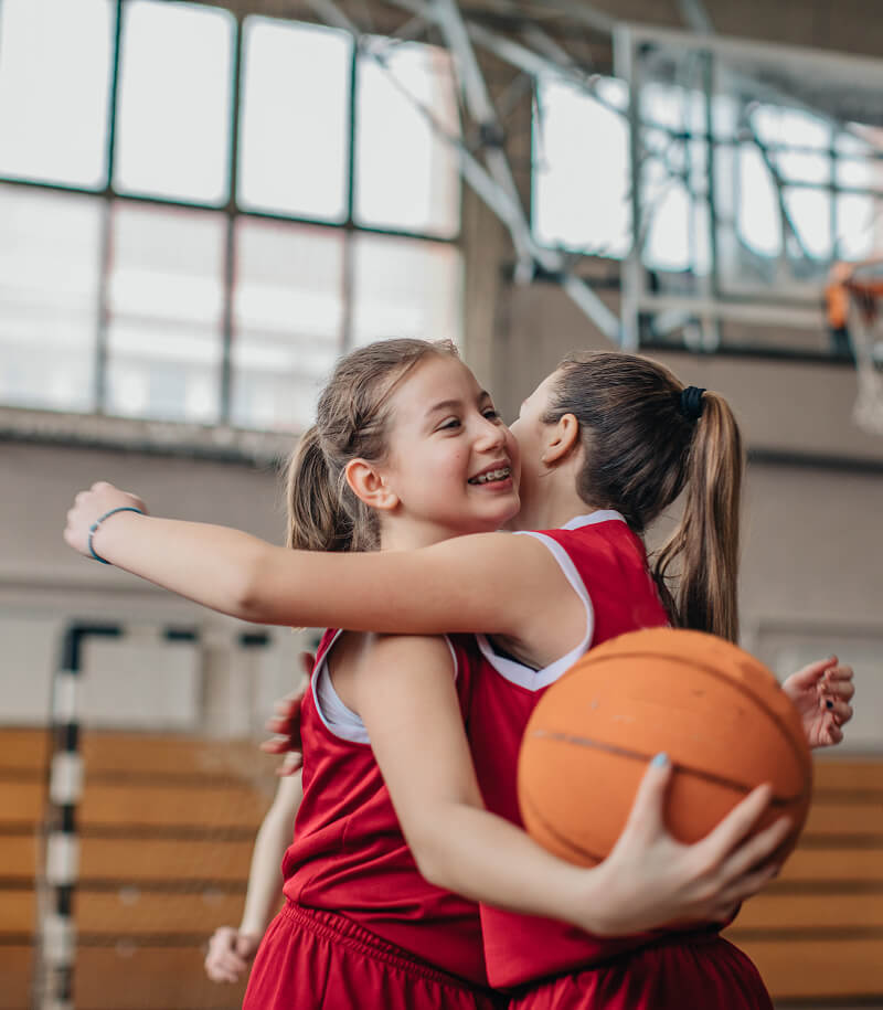 Girls playing basketball.