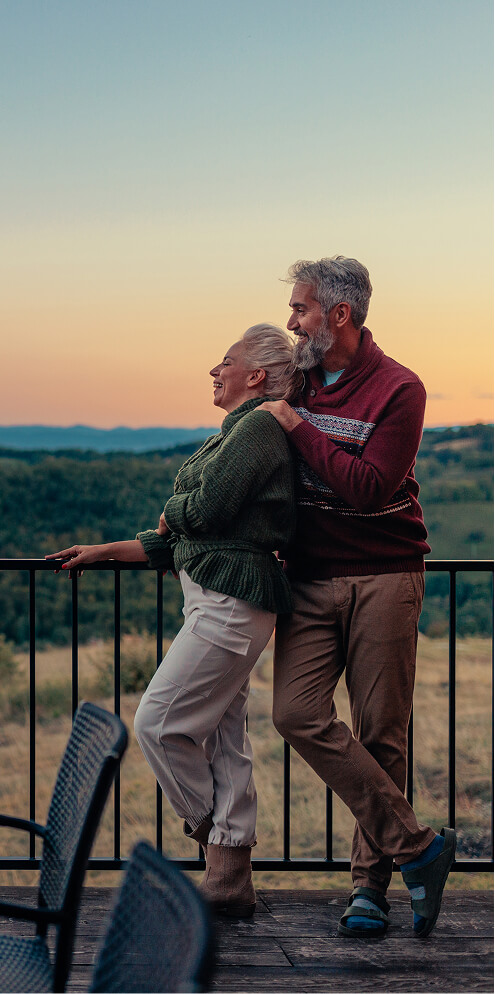 Mature couple with a scenic backdrop.