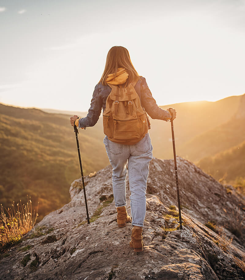 Woman hiking in mountains.