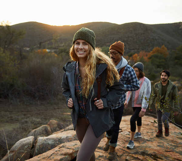 Group of friends hiking in mountains.