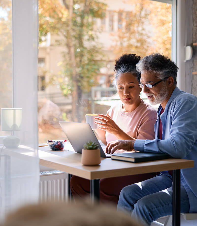 Mature couple on laptop.