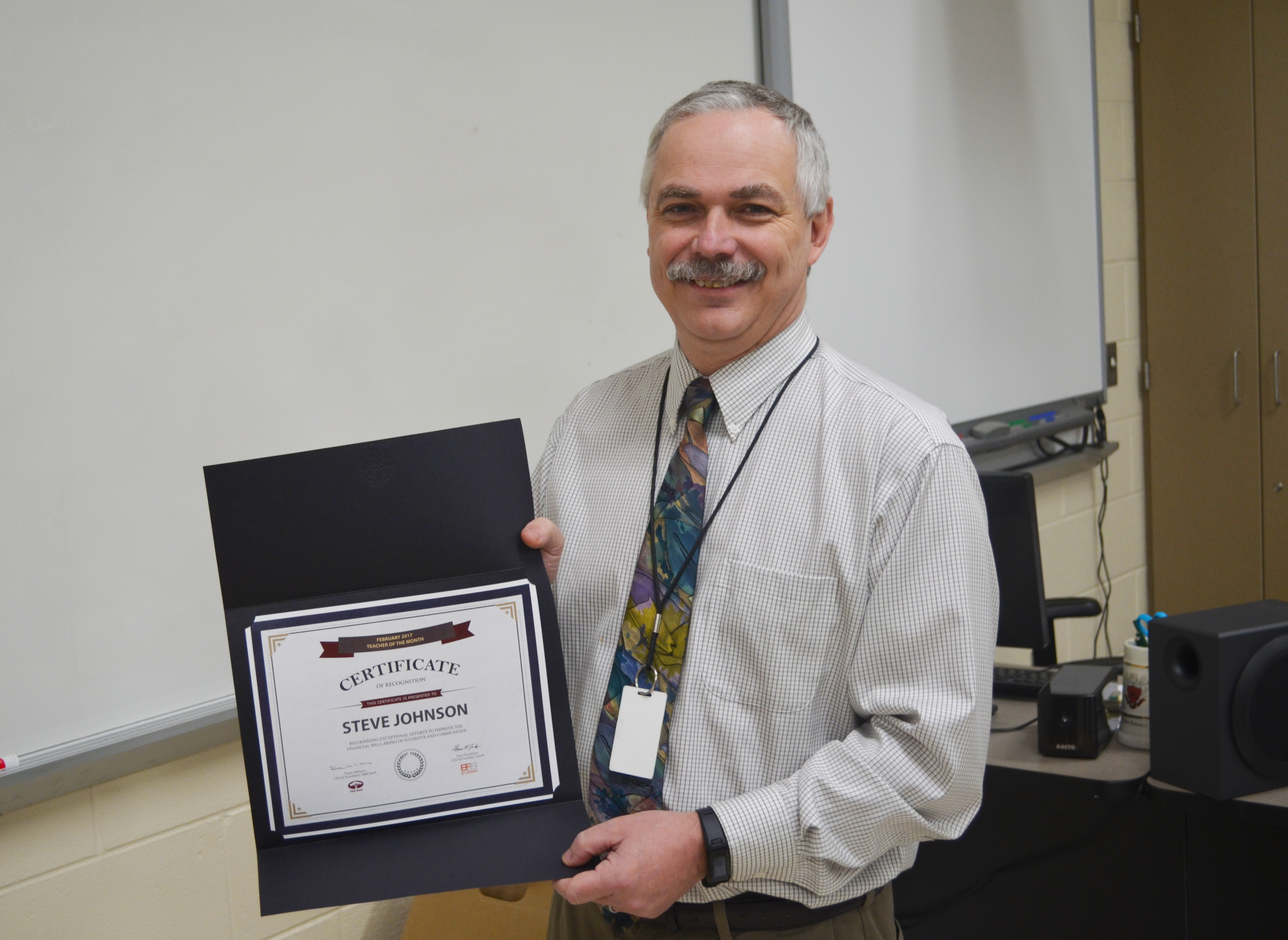 Photo of Luray High School teacher Steve Johnson with his Teacher of the Month certificate