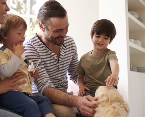 Family Sitting with Dog