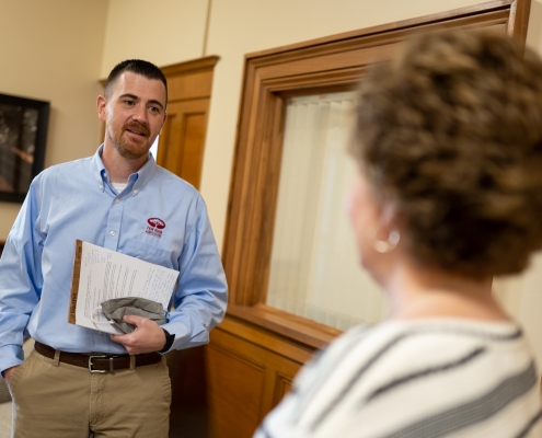 Bank employee talking with customer