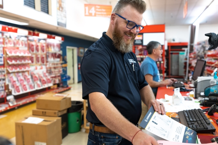 Randy’s Do It Best Hardware Store Christian Herrick of Randy's Do It Best ringing up a custoner
