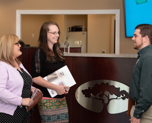 Photo of F&M bank retail, lending and ag team at teller line