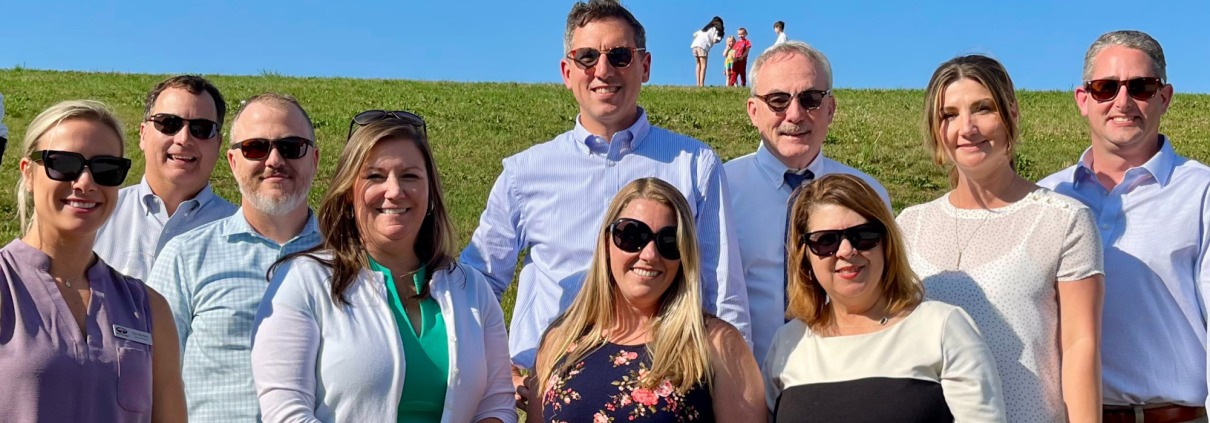 Group photo of F&M Bank Associates at Bluestone Vineyard celebrating a win in Shenandoah Valley's Best contest