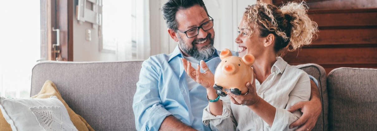 couple holding a piggy bank