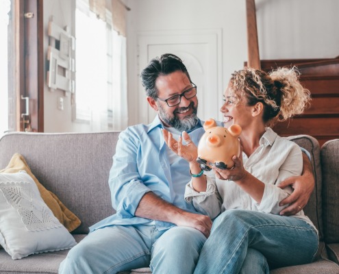 couple holding a piggy bank