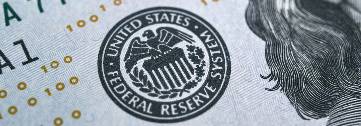 macro photo of federal reserve system symbol on hundred dollar bill.